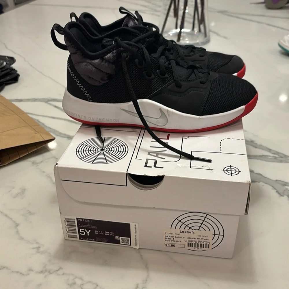 Worn once boys Nike paul George black metallic sneakers size 5! With box!